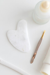 Minimal Skincare Flat Lay with Dropper Bottle and Face Tools