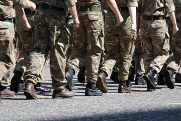 Military Personnel Marching: Legs and Uniform Detail from behind