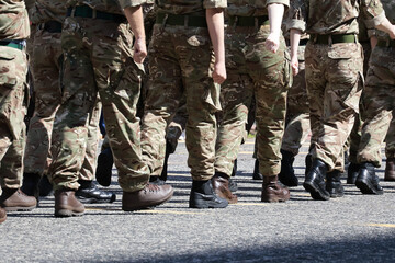 Military Personnel Marching: Legs and Uniform Detail from behind