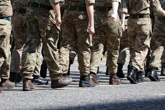 Military Personnel Marching: Legs and Uniform Detail from behind
