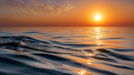 Obraz premium Tranquil Sunset Over Serene Sea with Warm Reflections