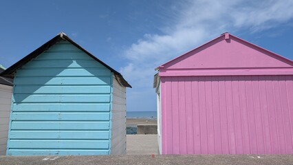 Obraz premium Colorful Roofs of Wooden Beach Houses in Saint-Aubin-sur-Mer, France