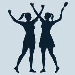 Silhouette image of two female tennis players winning