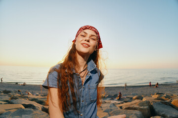 Lifestyle woman in modern boho-western denim street style smiling confidently outdoors during...