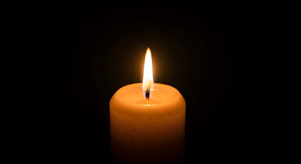 burning candle on a dark background