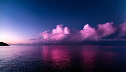 Fototapeta premium pink clouds over water at night
