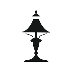 Elegant silhouette of a table lamp showcasing traditional design elements and dark aesthetic on white background.