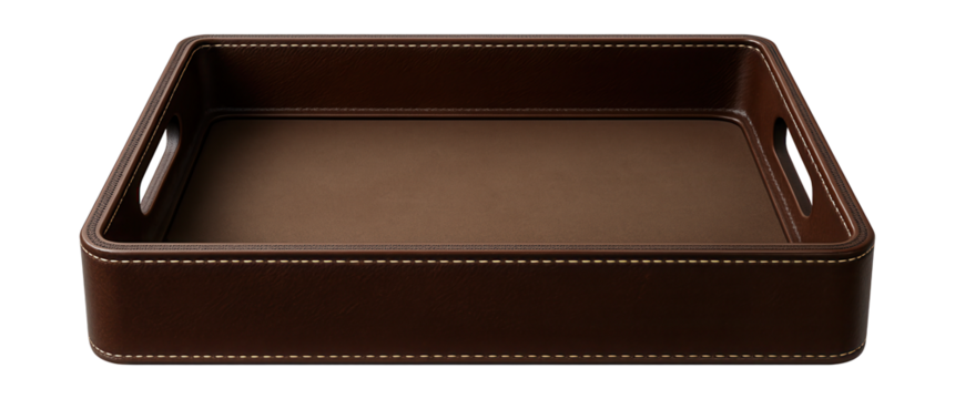 Leather serving tray with stitched edges, used for organizing remote controls and magazines on a living room ottoman.