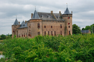 Fototapeta premium Muiderslot castle in North Holland, the Netherlands on a cloudy day.