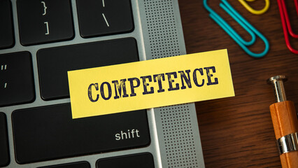 There is sticky note with the word Competence. It is as an eye-catching image.