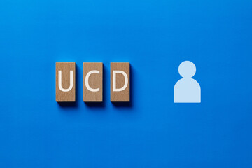 There is wood block with the word UCD. It is an abbreviation for User Centered Design as eye-catching image.