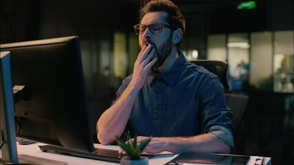 Business man tired sleepy guy businessman yawning overtime working computer in night dark office overwork male workaholic weary exhausted employee yawn low energy late time sleeping insomnia fatigue - Powered by Adobe