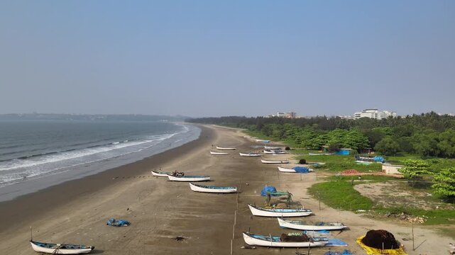 Aerial View of Baga Beach with Boats and Tourists Along Shoreline, North Goa, India