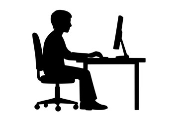 Silhouette of a person sitting at a desk using a computer