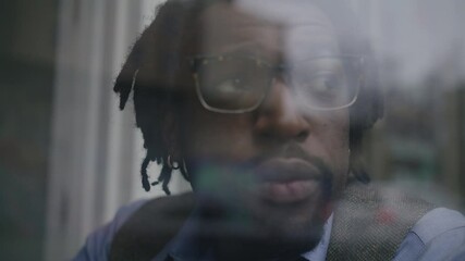 Man enjoys coffee while working on laptop at cozy coffee shop