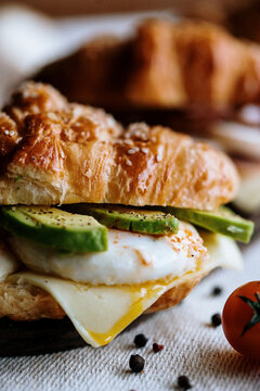 croissant  sandwich eggs and abocado 