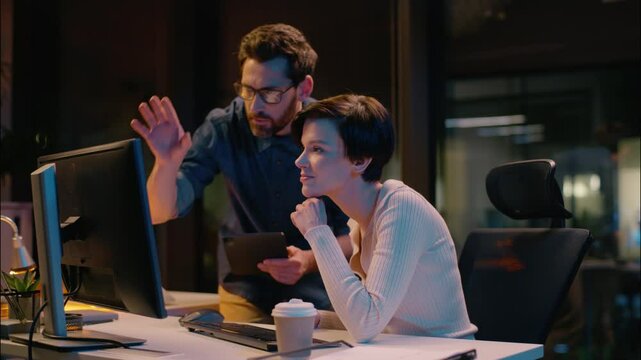 Business man woman cooperation in night office trader broker working computer stock market analysis bitcoin trading online crypto currency businessman businesswoman co-workers teamwork mentor intern