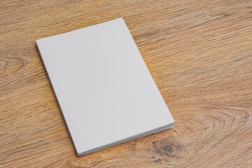 Realistic mockup of book cover, magazine on the wooden background. Concept for demonstrating...