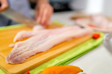 Chef cutting fresh fish for peruvian ceviche preparation