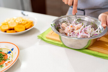 Chef preparing delicious peruvian ceviche with fresh ingredients