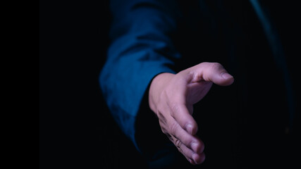 Businessman holding hands to shake hands to communicate business agreement and cooperation, concept of handshake or handshake of people meeting to cooperate or agree, greeting, accepting and thanking