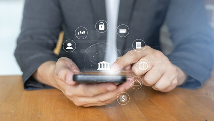 businessman hand hold smartphone and use private banking account application to using system function about checking stock market or transfer money worldwide for future tech concept