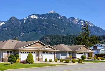 Street of residential duplex house on beautiful nature background in British Columbia