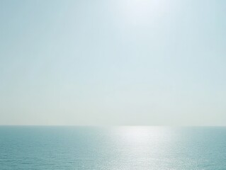 Obraz premium Serene Seascape: Calm Ocean Under Bright Sunlight