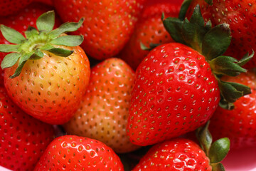 Close-up of ripe strawberries as background.