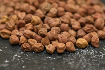 Raw chick peas, Chickpeas, Sundal also know as Chana Kondakadalai sundal closeup macro shot with cup.