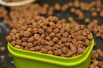 Raw chick peas, Chickpeas, Sundal also know as Chana Kondakadalai sundal closeup macro shot with cup.