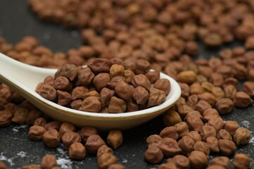 Raw chick peas, Chickpeas, Sundal also know as Chana Kondakadalai sundal closeup macro shot with cup.