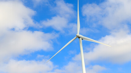 Aerial view of powerful Wind turbine farm for energy production on beautiful cloudy sky at...