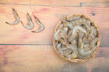 Fresh Raw Peel Shrimps or Peel Prawns on a Plate, Raw Shrimp,  (Litopenaeus vannamei) on wooden plate. 