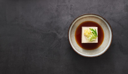 Cold Tofu Hiyayakko on black background, Japanese food, top view, copy space