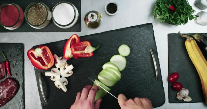 POV video in excellent quality chopping various legumes and vegetables