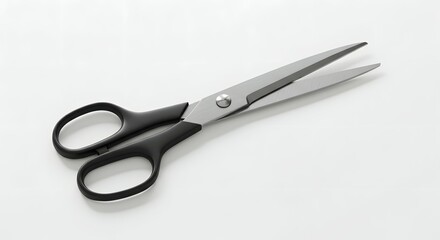 Fototapeta premium Classic Black Handle Scissors with Silver Blades on White Background, Essential Tool for Office, Craft, and Everyday Cutting Tasks