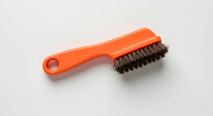 Compact Orange Handle Cleaning Brush with Stiff Bristles for Household and Shoe Care on White Background, Studio Shot