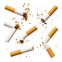 Multiple cigarettes are broken into pieces with tobacco spilling out, symbolizing the act of quitting smoking and breaking free from addiction.