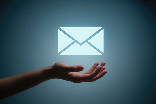 Glowing email icon appears above open hand against a moody blue background