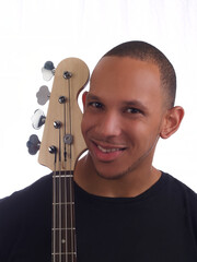 Smiling Young African American Man Holding Guitar