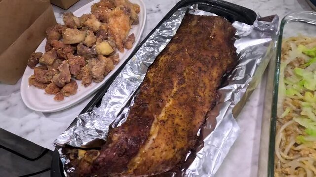 Discovering Filipino food with lechon, crispy pata, and more at a vibrant gathering. Savor iconic Filipino dishes at a vibrant festive gathering!