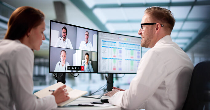 Busy Dentist Attending Online Learning Conference - Powered by Adobe