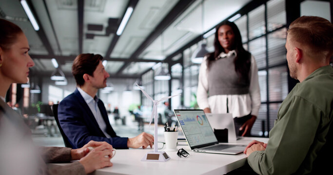 Diverse Corporate Team Discusses Sustainable Energy Strategy