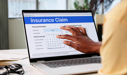 Young African American Woman Filling Out Online Life Insurance