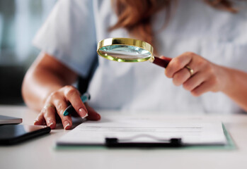 Fraud Investigation: Nurse Examining Medical Bill