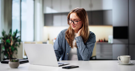 Pain-Free Businesswoman In Ergonomic Chair Behind Computer
