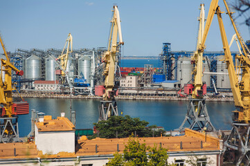 Seaport infrastructure in Odessa, Ukraine. Cargo cranes, containers, terminals and port warehouses...