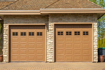 Garage door in luxury house with trees and nice landscape in Spring in Vancouver, Canada, North...