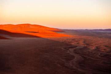 Fototapeta premium Exterior shot of the Namibian Sossusvlei sanddunes near the famous Dune 45 around sunrise